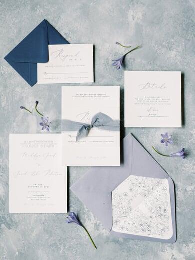 Minimal Modern Wedding Invitation with Custom Lace Dress Illustration and Silk Ribbon in Shades of Dusty Blue