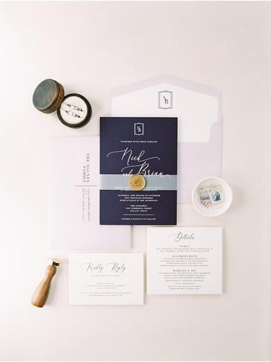 Simple Geometric Monogram Wedding Invitation in Plum with Vellum Band and Wax Seal