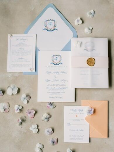 Water Color Monogram Wedding Invitation in Bright Coral, Blue and Blush with Vellum Wrap
