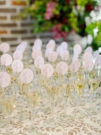 Circle Escort Cards on Champagne Glasses in Lavender Purple