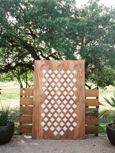 Diamond Shaped Escort Cards on Wooden Backdrop