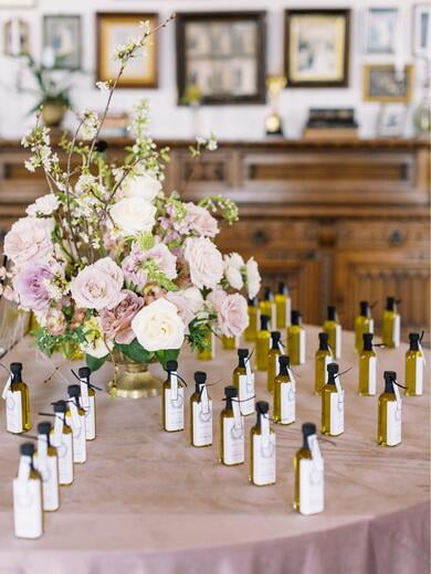 Monogrammed Olive Oil Bottle Escort Card Display