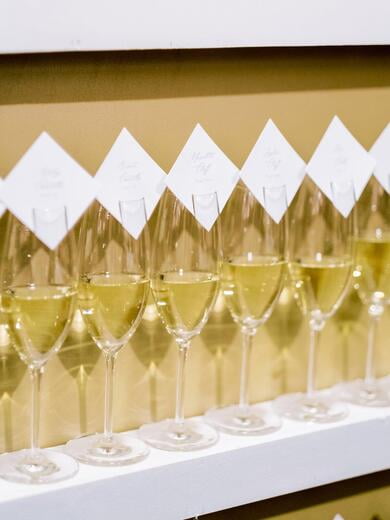 Sip and Be Seated Champagne Escort Cards on Glasses