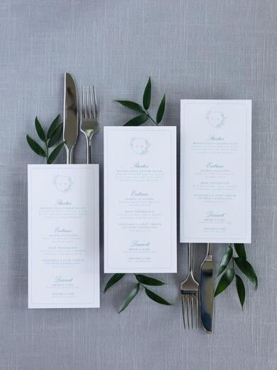 Pale Blue Wedding Menu with Delicate Greenery Monogram